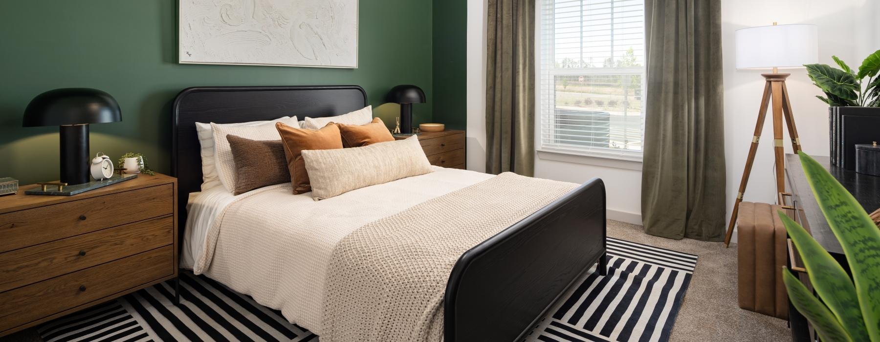 carpeted bedroom with large window